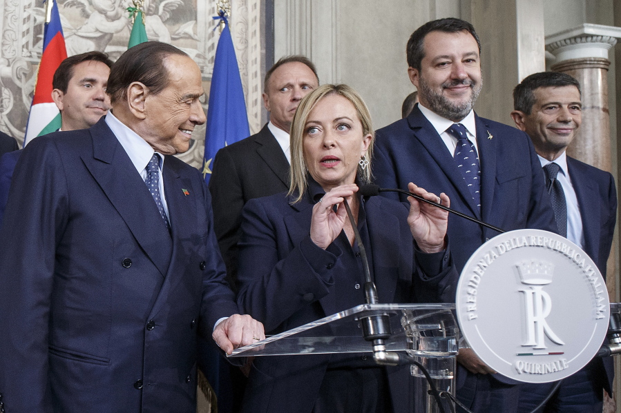 Brothers of Italy's leader Giorgia Meloni, center, flanked by Forza Italia's leader Silvio Berlusconi, left, and The League's leader Matteo Salvini, speaks to the press at the Quirinale Presidential Palace after talks with Italian President Sergio Mattarella, Friday, Oct. 21, 2022, who will appoint a new Italian premier after Sept. 25 political elections.