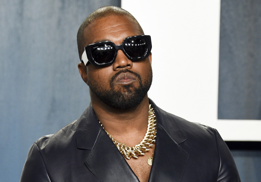 FILE - Kanye West arrives at the Vanity Fair Oscar Party on Feb. 9, 2020, in Beverly Hills, Calif. West's Twitter and Instagram accounts have been locked because of posts by the rapper, now known legally as Ye, that were widely deemed antisemitic, according to reports, Sunday, Oct. 9, 2022.