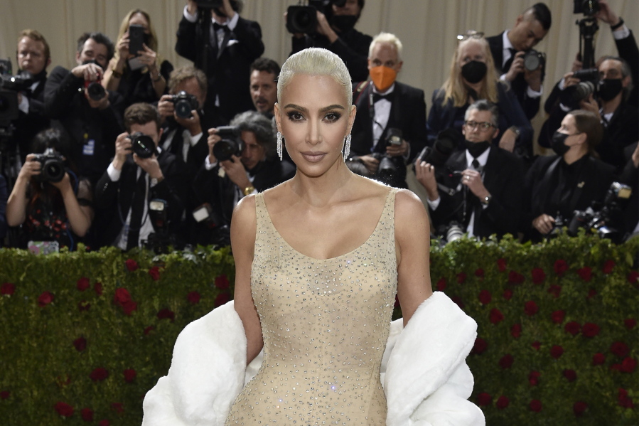 FILE - Kim Kardashian attends The Metropolitan Museum of Art's Costume Institute benefit gala celebrating the opening of the "In America: An Anthology of Fashion" exhibition on Monday, May 2, 2022, in New York. Reality tv star and entrepreneur Kim Kardashian has agreed to settle charges brought by the Securities and Exchange Commission and pay $1.26 million because she promoted on social media a crypto asset security offered and sold by EthereumMax without disclosing the payment she received for the plug. The SEC said Monday, Oct.