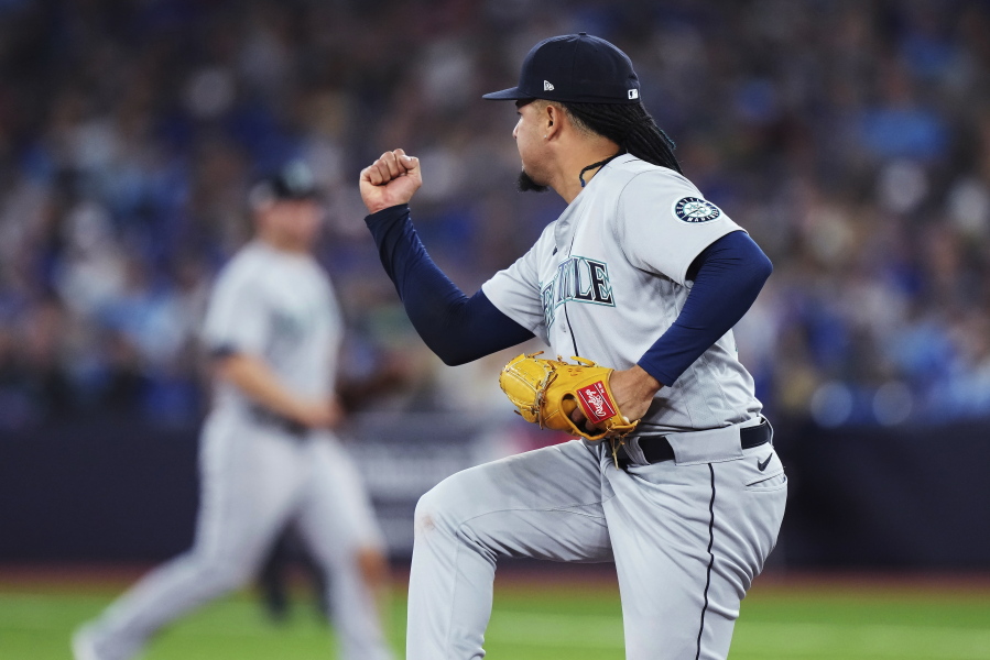 Seattle Mariners starting pitcher Luis Castillo reacts after striking out Toronto Blue Jays' Danny Jansen during the seventh inning of Game 1 of a baseball AL wild-card series, Friday, Oct. 7, 2022, in Toronto.