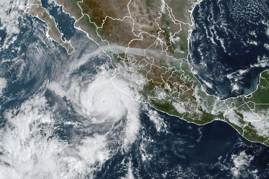 This satellite image taken at 15:30 UTC and provided by NOAA shows Hurricane Roslyn approaching the Pacific coast of Mexico, Saturday, Oct. 22, 2022. Roslyn grew to Category 4 force on Saturday as it headed for a collision with Mexico's Pacific coast, likely north of the resort of Puerto Vallarta.