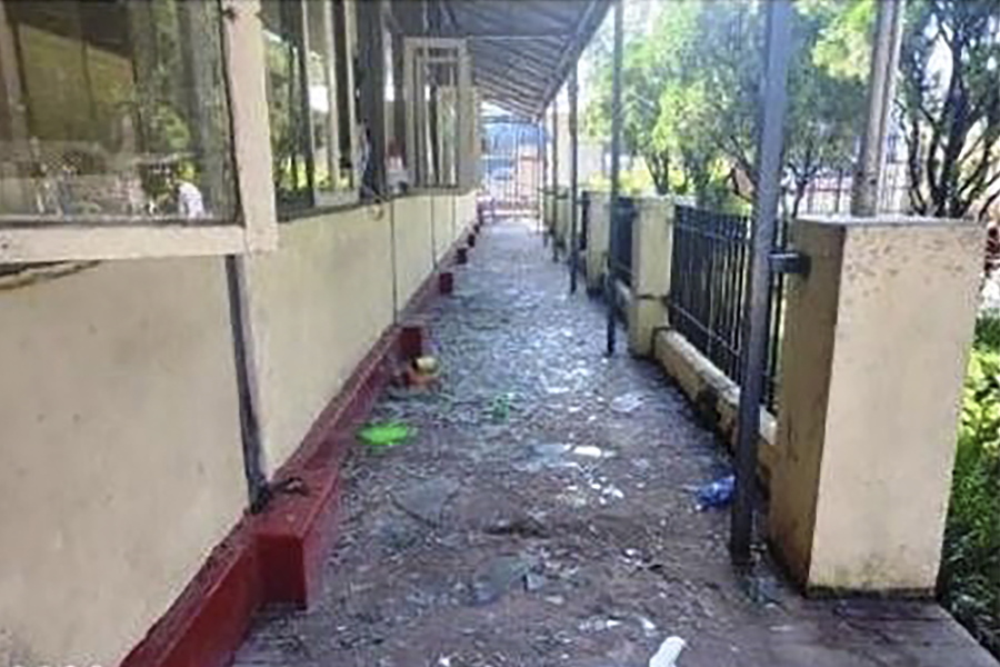 In this photo provided by the Military True News Information Team, a parcel-reception location at the entrance of the Insein prison sits damaged after an explosion Wednesday, Oct. 19, 2022, in Yangon, Myanmar. A bombing on Wednesday near the front gate of Myanmar's main prison for political detainees killed a number people, including visitors and prison personnel, local media and the government said.