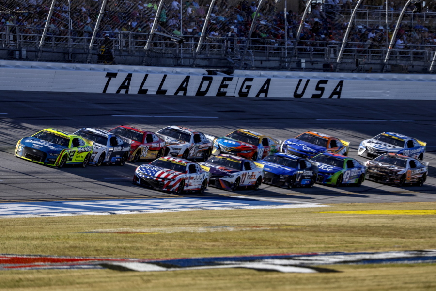 Ryan Blaney (12) leads the field through the tri-oval during a NASCAR Cup Series auto race Sunday, Oct. 2, 2022, in Talladega, Ala.