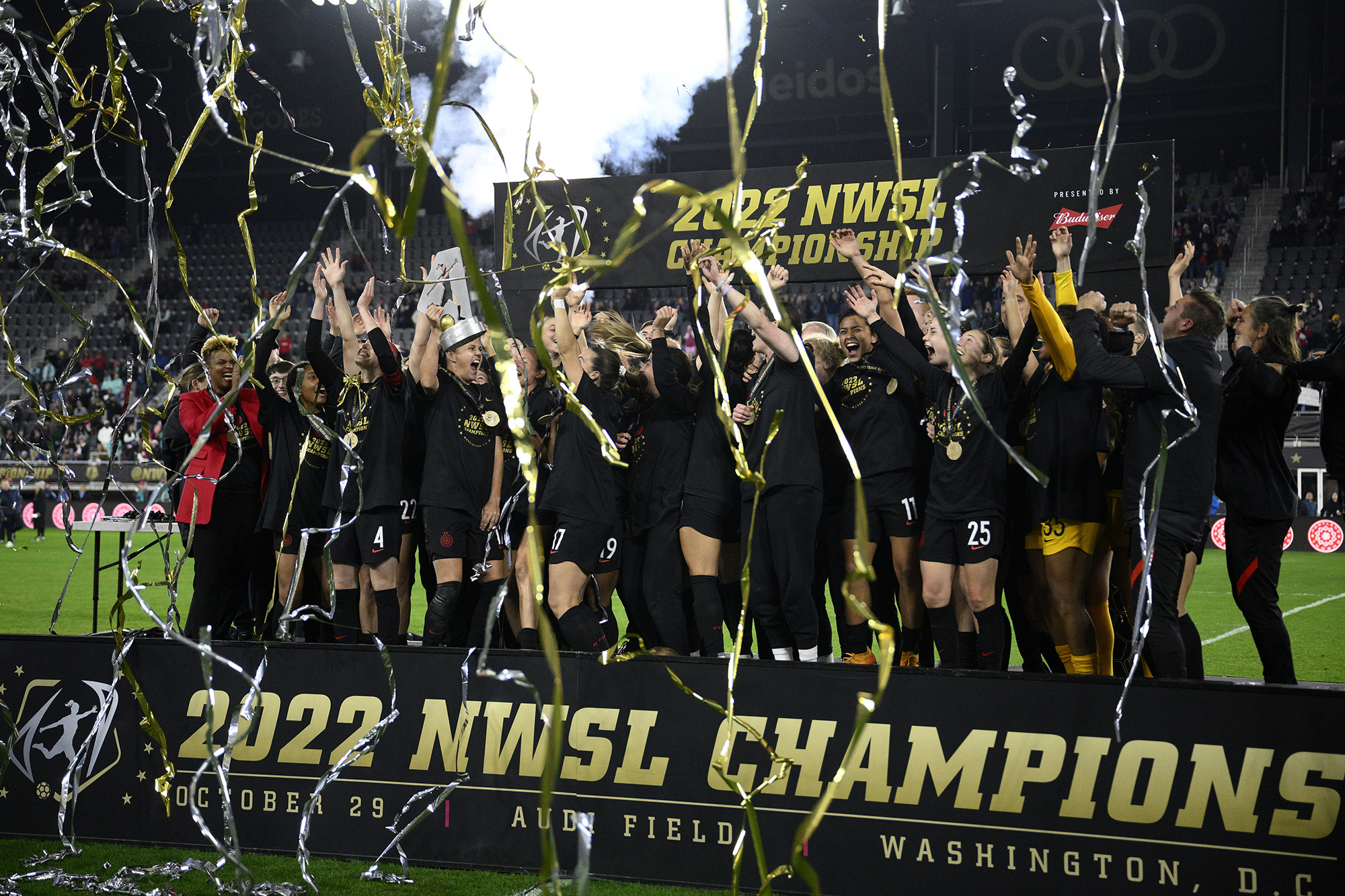 Portland Thorns FC celebrate with the trophy after they won the NWSL championship soccer match against the Kansas City Current, Saturday, Oct. 29, 2022, in Washington. Portland won 2-0.