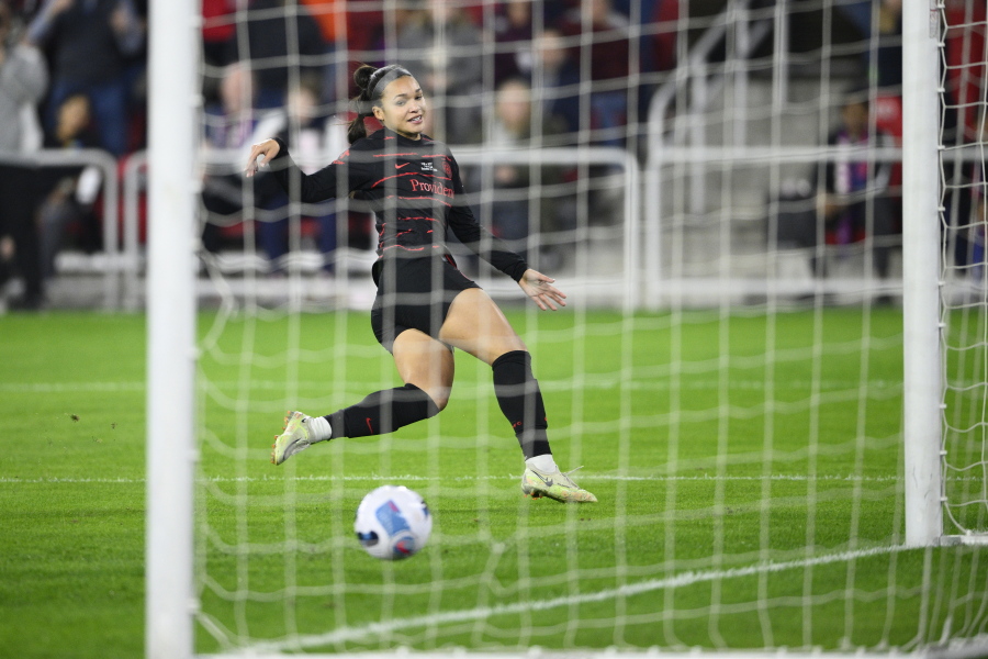 Portland Thorns FC forward Sophia Smith (9) scores a goal during the first half of the NWSL championship soccer match against the Kansas City current, Saturday, Oct. 29, 2022, in Washington.