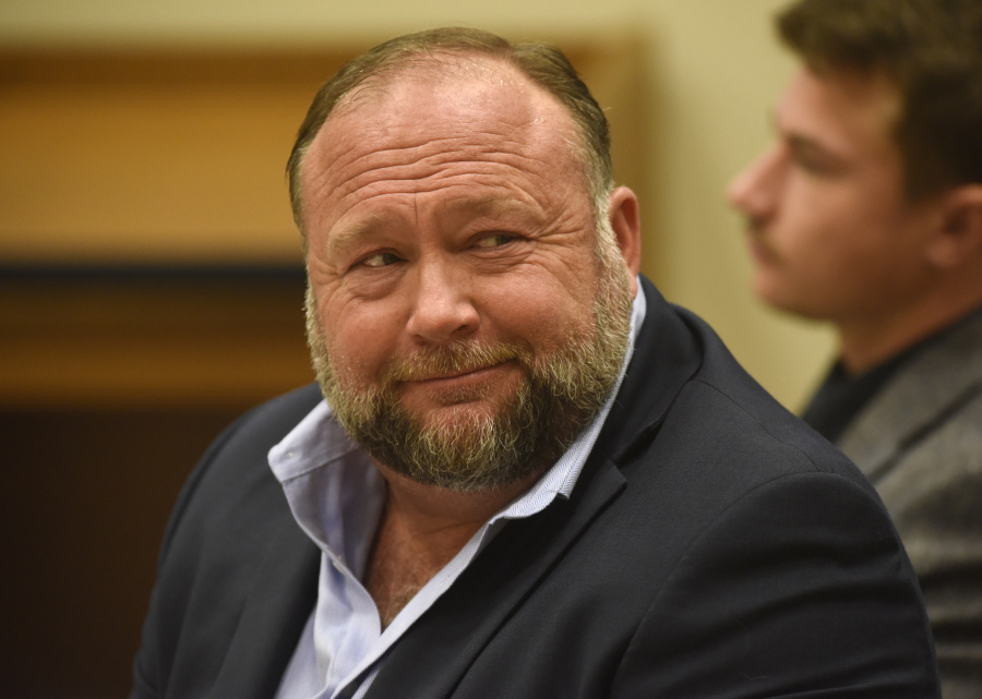 Infowars founder Alex Jones appears in court to testify during the Sandy Hook defamation damages trial at Connecticut Superior Court in Waterbury, Conn. Thursday, Sept. 22, 2022. Jones was found liable last year by default for damages to plaintiffs without a trial, as punishment for what the judge called his repeated failures to turn over documents to their lawyers. The six-member jury is now deciding how much Jones and Free Speech Systems, Infowars' parent company, should pay the families for defaming them and intentionally inflicting emotional distress.