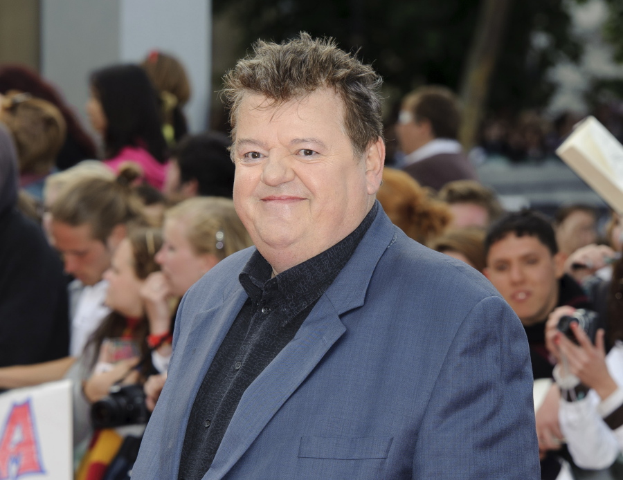 FILE - Robbie Coltrane arrives in Trafalgar Square, central London, for the world premiere of "Harry Potter and The Deathly Hallows: Part 2," the last film in the series on July 7, 2011. Coltrane, who played a forensic psychologist on TV series "Cracker" and Hagrid in the "Harry Potter" movies, has died. Coltrane's agent Belinda Wright said he died Friday at a hospital in Scotland. He was 72.