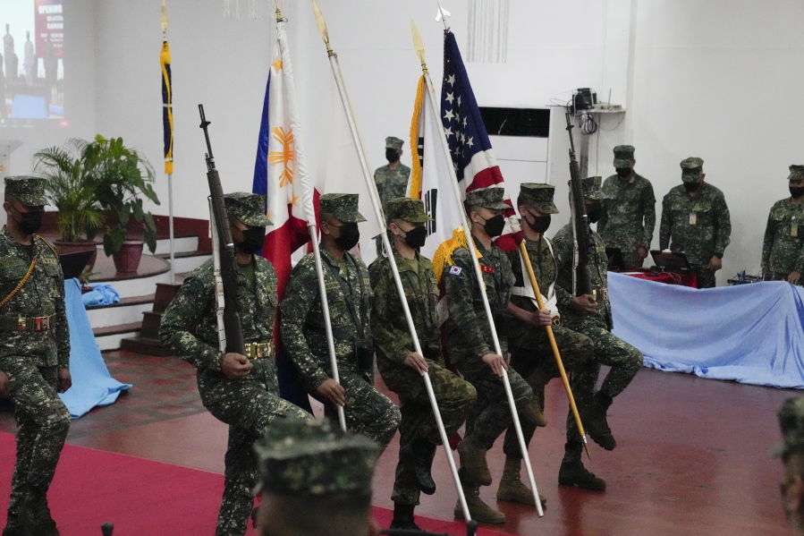 Marines from Philippines, Japan, South Korea and the United States carry their flag during opening ceremonies of an annual joint military exercise called Kamandag the Tagalog acronym for "Cooperation of the Warriors of the Sea" at Fort Bonifacio, Taguig city, Philippines on Monday Oct. 3, 2022. More than 2,500 U.S. and Philippine marines launched combat exercises Monday to be able to jointly respond to any sudden crisis in a region long on tenterhooks over the South China Sea territorial disputes and China?fs increasingly hostile actions against Taiwan.