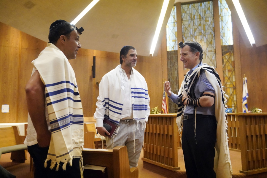 Rabbi David Wolpe, right, speaks to congregants at Sinai Temple on Sept. 23 in Los Angeles.