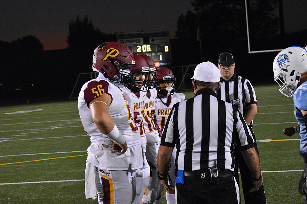 Prairie's Kaleb Watson (56) makes the call on the opening coin toss before the Falcons' game at Corvallis, Ore., on Friday, Oct. 14, 2022.