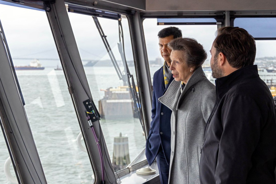 This photo, provided by the New York City Department of Transportation shows Britain's Princess Anne, accompanied by the agency's Commissioner Ydanis Rodriguez, left, as she rides in the pilothouse of the Staten Island Ferry "Sandy Ground," in New York Harbor, Tuesday, Oct. 4, 2022. The trip on a the commuter ferry came after the princess was given a tour of Staten Island's National Lighthouse Museum that included an an unveiling of a miniature figurine of Needles Lighthouse, in the Isle of Wight, in memory of her parents.