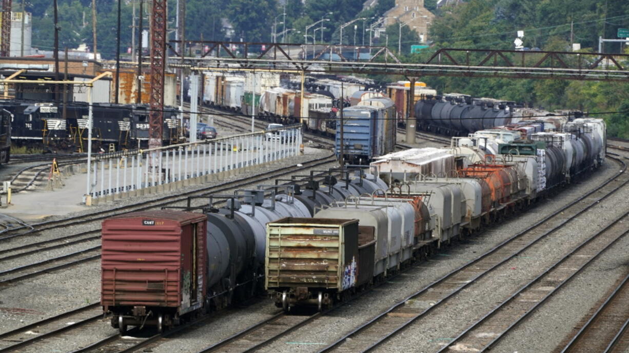 Freight cars wait to be hauled out of the Norfolk Southern Conway Terminal in Conway, Pa., Thursday, Sept. 15, 2022. (AP Photo/Gene J.