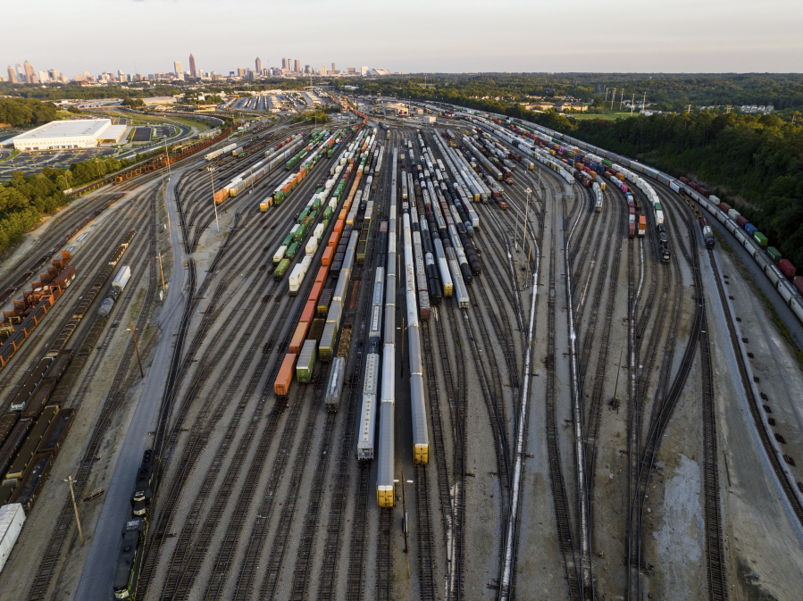 FILE - Freight train cars sit in a Norfolk Southern rail yard on Sept. 14, 2022, in Atlanta. Businesses are increasingly worried about the renewed threat of a railroad strike after two unions rejected their deals, and they want the White House and Congress to be ready to intervene. A coalition of 322 business groups sent a letter to President Joe Biden on Thursday, Oct. 27, 2022, urging him to make sure the deals he helped broker last month get approved because a railroad strike would have dire consequences for the economy.