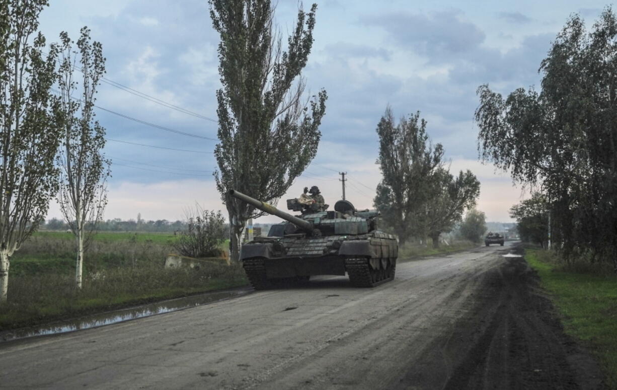 Ukrainian servicemen drive a tank on the way to Siversk, Donetsk region, Ukraine, Saturday, Oct. 1, 2022.