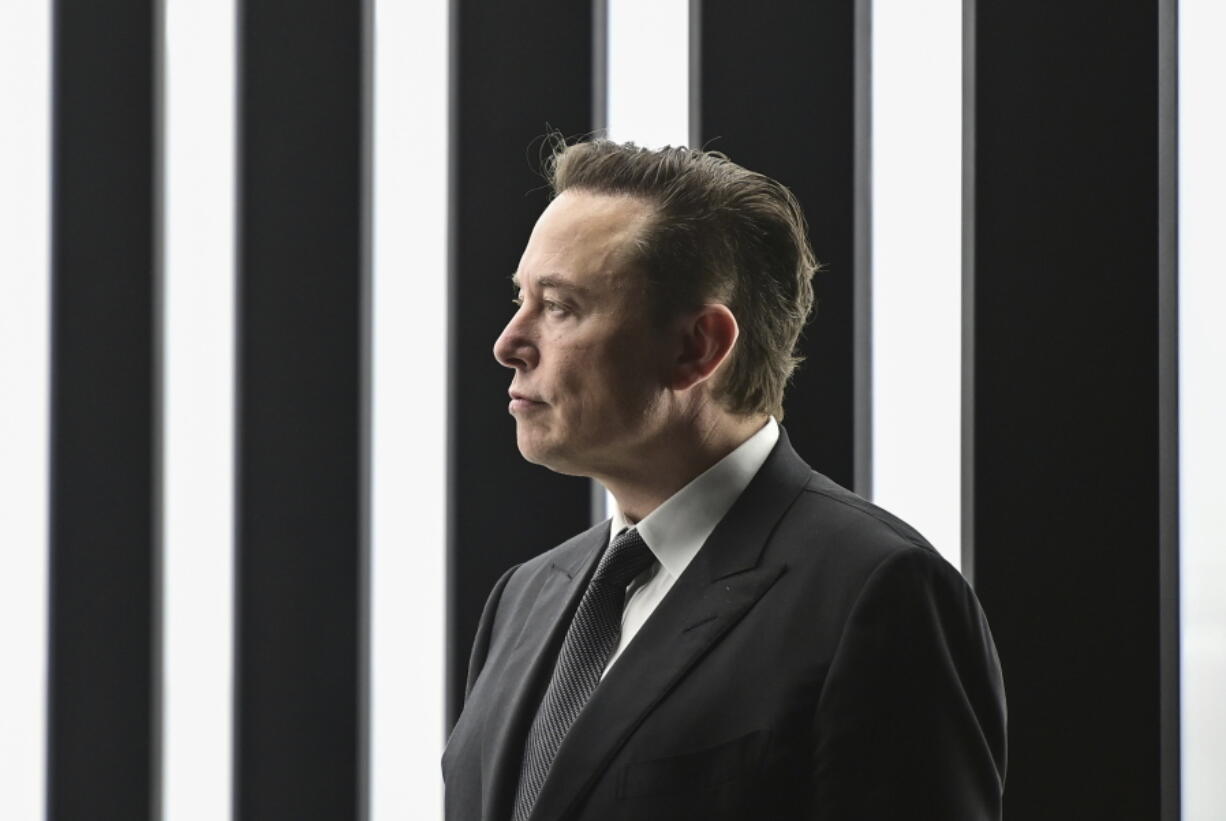 FILE - Elon Musk, Tesla CEO, attends the opening of the Tesla factory Berlin Brandenburg in Gruenheide, Germany, March 22, 2022. Tesla CEO Elon Musk has proposed a peace plan for Ukraine that would involve holding repeat votes under the U.N. auspices in Russia-occupied regions, triggering a showdown with Ukrainian Twitter users who have rejected his proposals in a stream of furious comments.