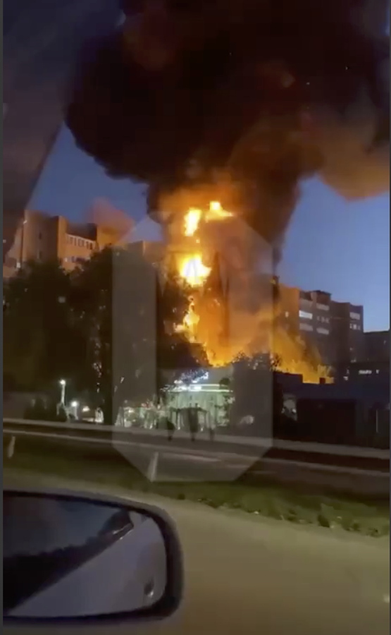 In this handout photo taken from video released by OSTOROZHNO NOVOSTI, flames and smoke rise from the scene where a warplane crashed into a residential area in Yeysk, Russia, Monday, Oct. 17, 2022. The Russian military says one of its warplanes crashed in the port of Yeysk on the Sea of Azov after experiencing engine failure. The Russian Defense Ministry said that a Su-34 bomber crashed into a residential area in Yeysk and caused a fire on Monday.