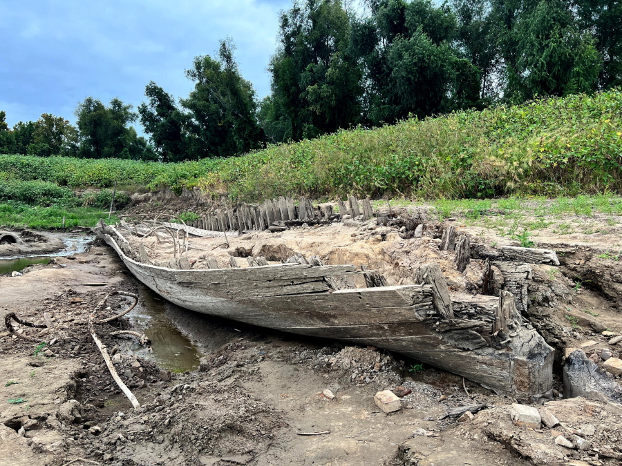 The remains of a ship lay on the banks of the Mississippi River in Baton Rouge, La., on Monday, Oct. 17, 2022, after recently being revealed due to the low water level. The ship, which archaeologists believe to be a ferry that sunk in the late 1800s to early 1900s, was spotted by a Baton Rouge resident walking along the shore earlier this month.
