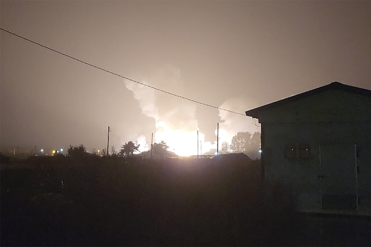 In am image taken from video, flames and smoke rise from a military airbase Wednesday, Oct. 5, 2022, in Gangnueng, South Korea. South Korea's Joint Chiefs of Staff said no injuries were reported from the explosion which involved a short-range Hyumoo-2 missile.