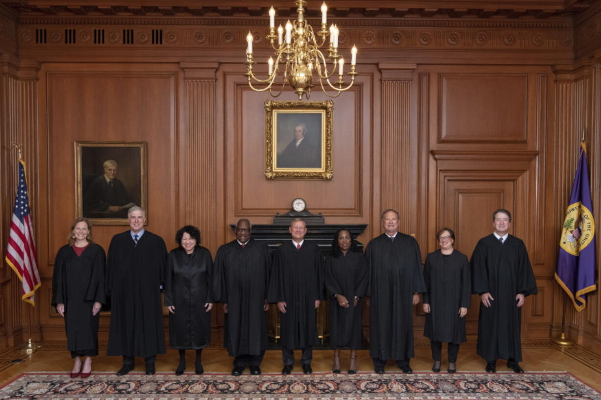 Members of the Supreme Court pose for a photo during Associate Justice Ketanji Brown Jackson's formal investiture ceremony on Friday. From left: Associate Justice Amy Coney Barrett, Associate Justice Neil Gorsuch, Associate Justice Sonia Sotomayor, Associate Justice Clarence Thomas, Chief Justice John Roberts, Associate Justice Ketanji Brown Jackson, Associate Justice Samuel Alito, Associate Justice Elena Kagan and Associate Justice Brett Kavanaugh. (fred schilling/U.S.
