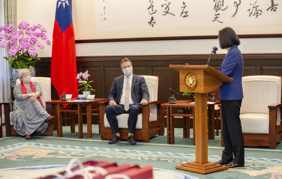 In this photo released by the Taiwan Presidential Office, Taiwan's President Tsai Ing-wen, right, speaks during a meeting with a group of German lawmakers led by Free Democratic Party's Peter Heidt, center, at the Presidential Office in Taipei, Taiwan, Monday, Oct. 24, 2022. Any changes to the China-Taiwan relationship must come about peacefully, a visiting German lawmaker said Monday, two days after China's ruling Communist Party wrote its rejection of Taiwan independence into its charter.