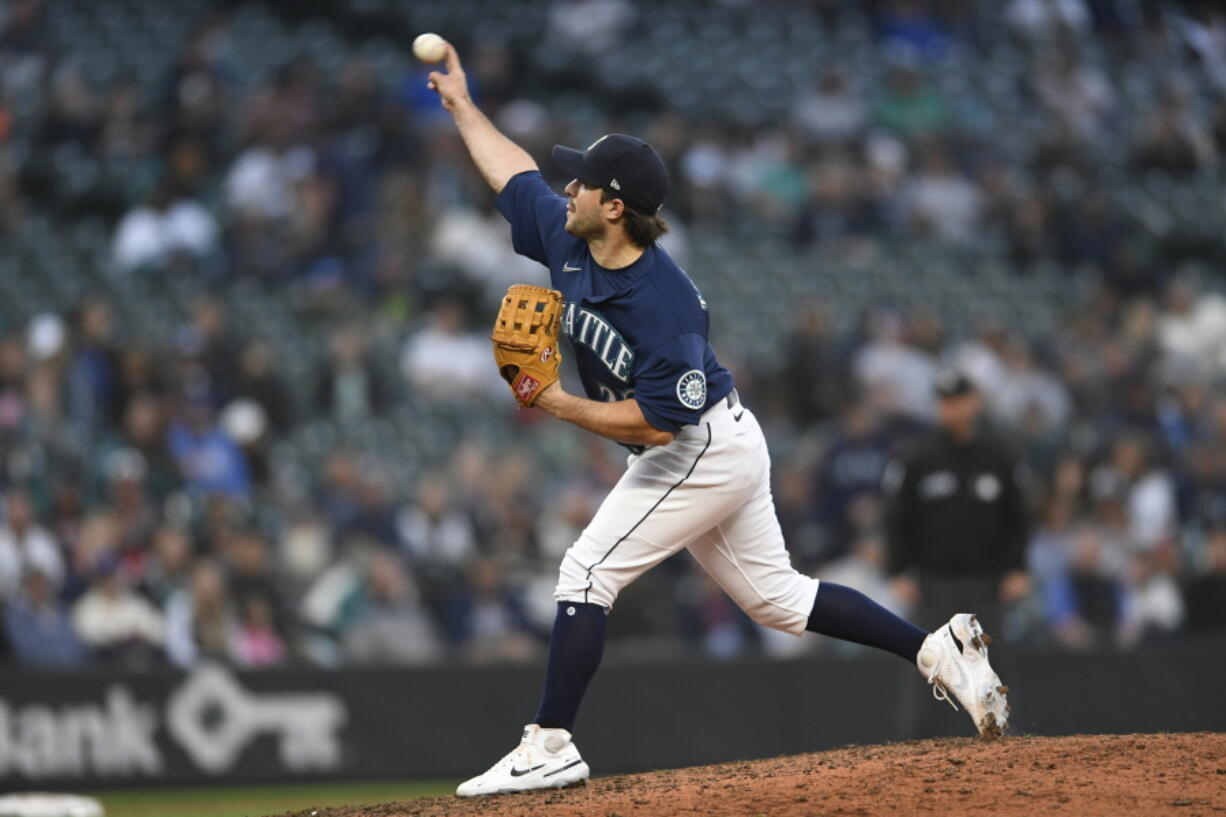 Seattle Mariners catcher Luis Torrens pitches against the Detroit Tigers during the 10th inning of the first game of a baseball doubleheader, Tuesday, Oct. 4, 2022, in Seattle.