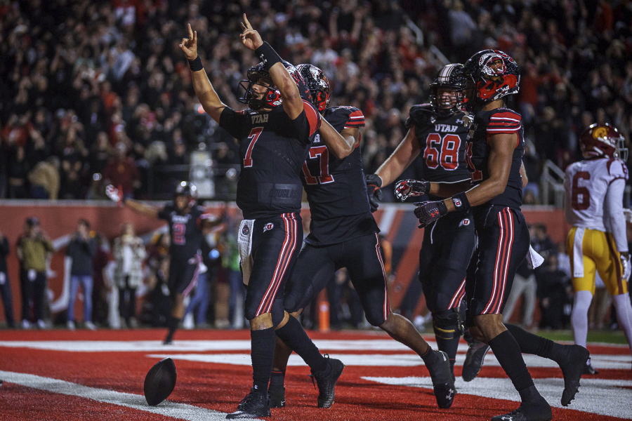 Utah quarterback Cameron Rising (7) celebrates a 2-point conversion against Southern California during an NCAA college football game Saturday, Oct. 15, 2022, in Salt Lake City.