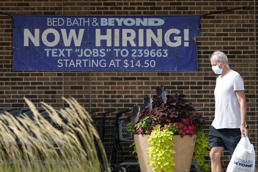 Hiring sign is displayed in Deerfield, Ill., Wednesday, Sept. 21, 2022. The number of Americans filing for jobless benefits dropped last week, a sign that few companies are cutting jobs despite high inflation and a weak economy. Applications for unemployment benefits for the week ending Sept. 24 fell by 16,000 to 193,000, the Labor Department reported Thursday, Sept. 29.   (AP Photo/Nam Y.