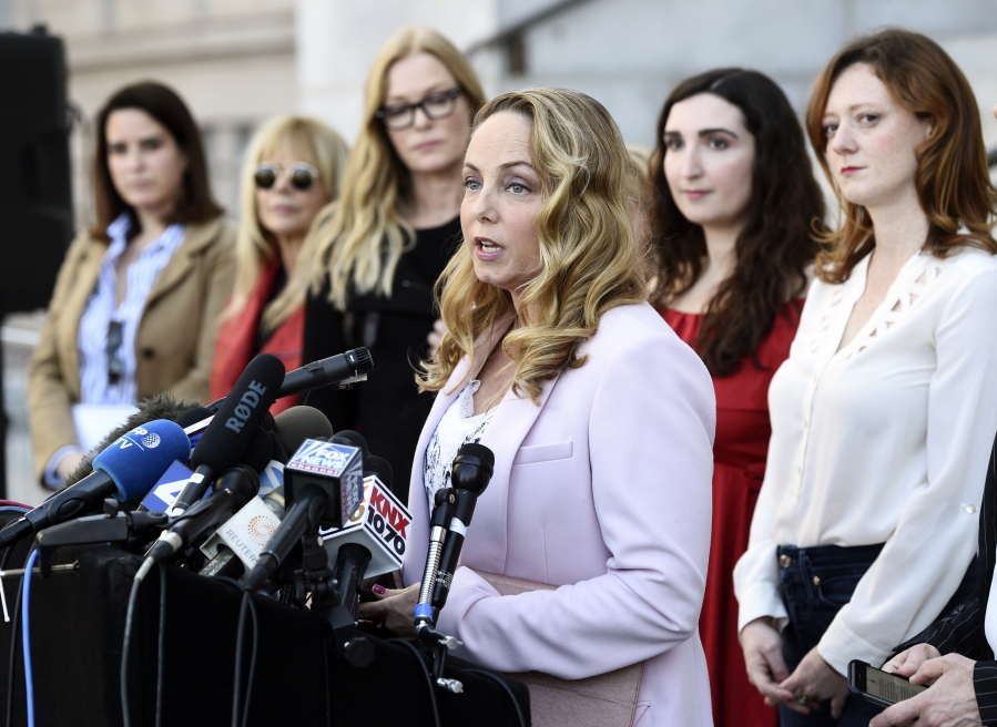 FILE - Actress Louisette Geiss speaks at a news conference by the "Silence Breakers," a group of women who have spoken out about Hollywood producer Harvey Weinstein's sexual misconduct, at Los Angeles City Hall, on Feb. 25, 2020, in Los Angeles. Geiss, a former actress and screenwriter who accused Weinstein in 2017, has written a musical stemming from her experiences with Weinstein. "The Right Girl," which was waylaid by the pandemic but will be produced live onstage sometime in 2023.
