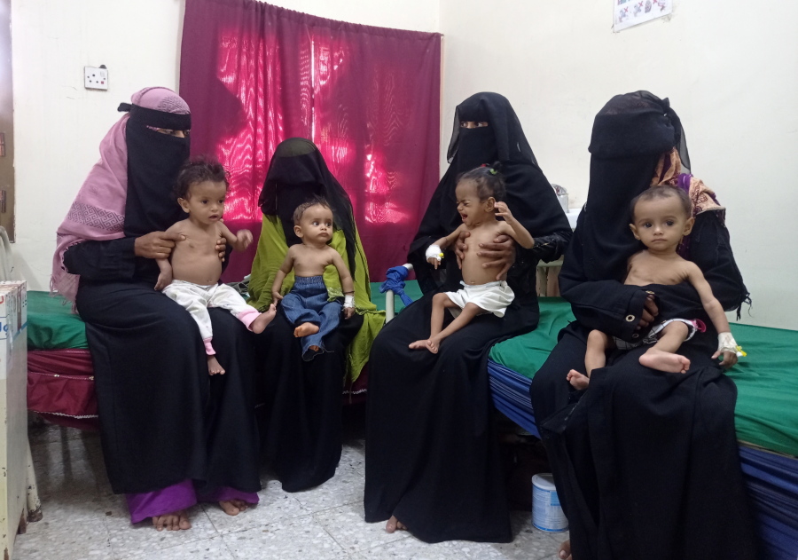 Women hold their malnourished children at the Hays Rural Hospital in Hodeida, Yemen, Oct. 11, 2022. For years starvation has been an everyday threat for Yemen's children. Now, as the war threatens to escalate between the country's warring parties after months of a tenuous truce, there are fears that it could get worse.