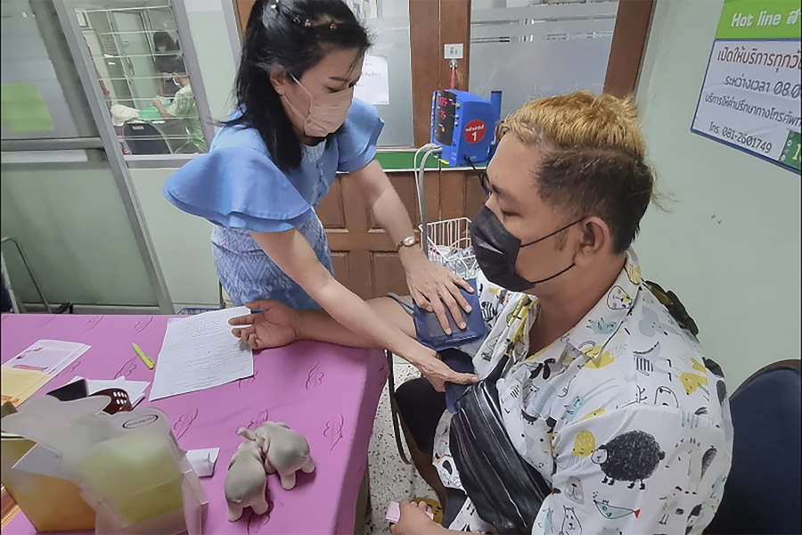 A resident donates blood a the local hospital for victims of an attack at a daycare center, Thursday, Oct. 6, 2022, in the town of Nongbua Lamphu, north eastern Thailand. More than 30 people, primarily children, were killed Thursday when a gunman opened fire in the childcare center authorities said.