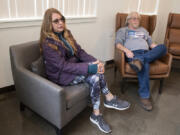 Stella Kirkman, left, and James Donahue talk in the lobby of Miles Terrace, a low-income housing complex for seniors developed by the Vancouver Housing Authority.