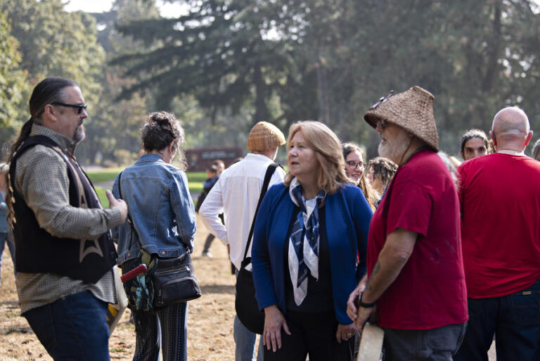 Chinook Indian Nation Chairman Tony Johnson, left, discusses federal recognition for his tribe with Vancouver Mayor Anne McEnerny-Ogle and Chinook Vice Chairman Sam Robinson of Vancouver on Oct. 7 at a rally at Fort Vancouver National Historic Site.