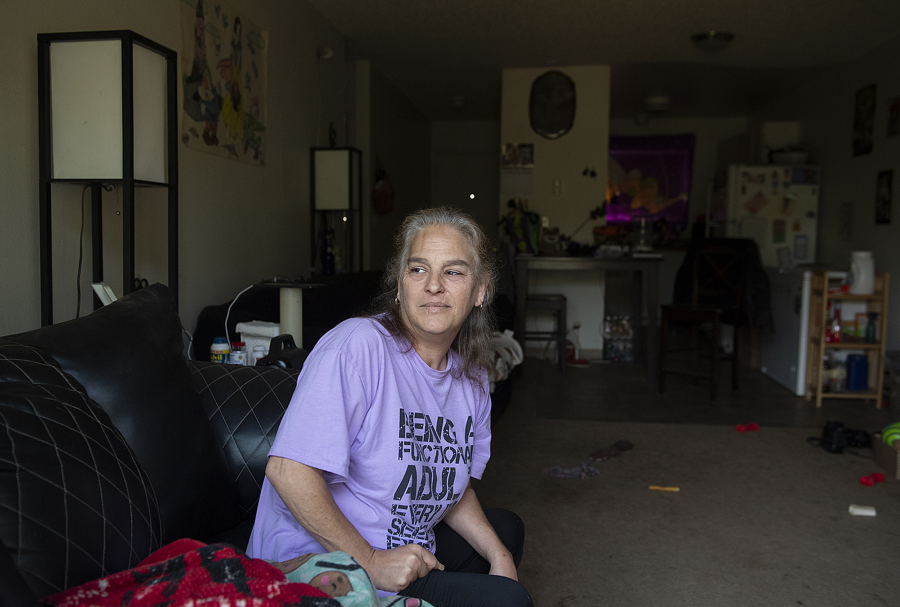 Saree Adams, a tenant at Rockwood Terrace in Washougal, sits in her two-bedroom apartment where she has lived for 10 years. The complex recently raised rents by nearly $400 for some residents, an increase of about 40 percent. Adams and many other residents say they cannot pay the new price.