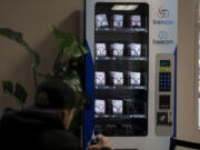 A free Naloxone vending machine is pictured at Recovery Cafe, providing access to the life-saving drug to anyone in need.