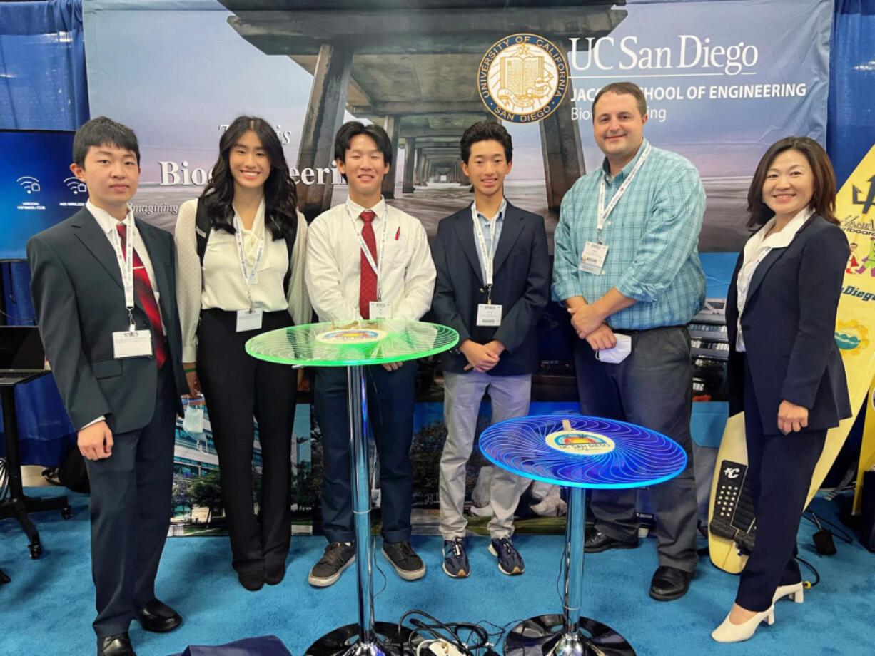 Joy Young, second from left, stands alongside fellow students and faculty advisers from the University of California San Diego's Institute for Biomedical Engineering on Oct. 11 at the 2022 Biomedical Engineering Society Conference in San Antonio, Texas.