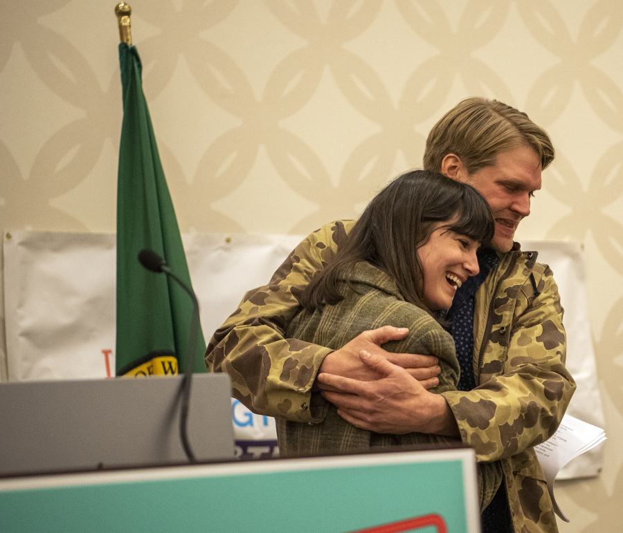 Democrat Marie Gluesenkamp Perez hugs her husband, Dean Gluesenkamp, after delivering a speech to supporters Tuesday evening at the Clark County Democrats election night watch party at the Hilton Vancouver Washington.