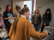 Sarah Hubbard, 16, center, who is studying digital design through Ridgefield High School's Center for Advanced Professional Studies program, demonstrates how to use a drawing tablet for tour visitors Wednesday afternoon. "Students really take ownership of their work here," said Jared Hundley, the CAPS program director. "There's incentive for them.