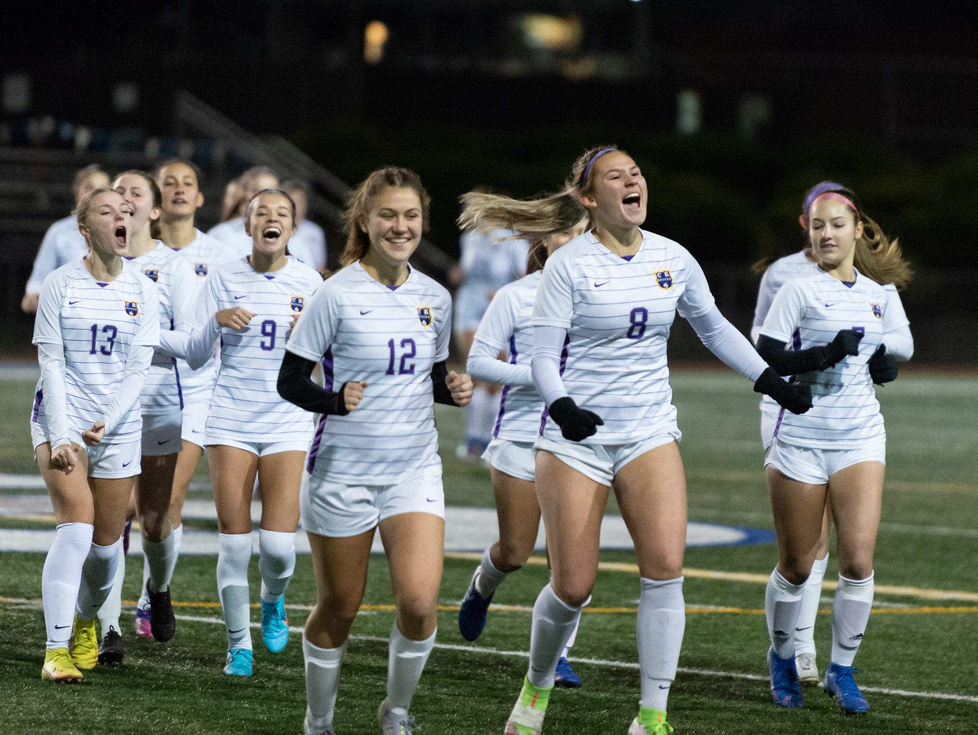 Columbia River's Maree Seibel screams as she leads the Rapids off the field before the 2A State Girls Soccer semifinals on Friday, Nov. 18, at Shoreline Stadium.