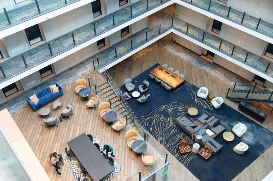 A large, open atrium greets guests upon their arrival at Hotel Indigo, which has opened for business.