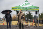 Clark County Food Bank President Alan Hamilton, center, and Board Chair Elson Strahan, left, stand and deliver speeches during a groundbreaking ceremony for the Clark County Food Bank's new Vision Center.