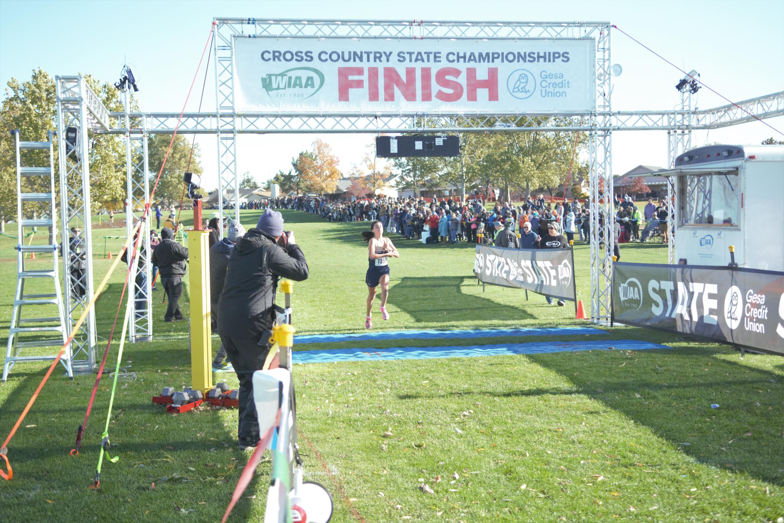 Alexis Leone of Seton Catholic crosses the finish line to repeat as Class 1A girls champion at the WIAA State Cross Country Championship on Saturday Nov. 5, 2022 in Pasco.
