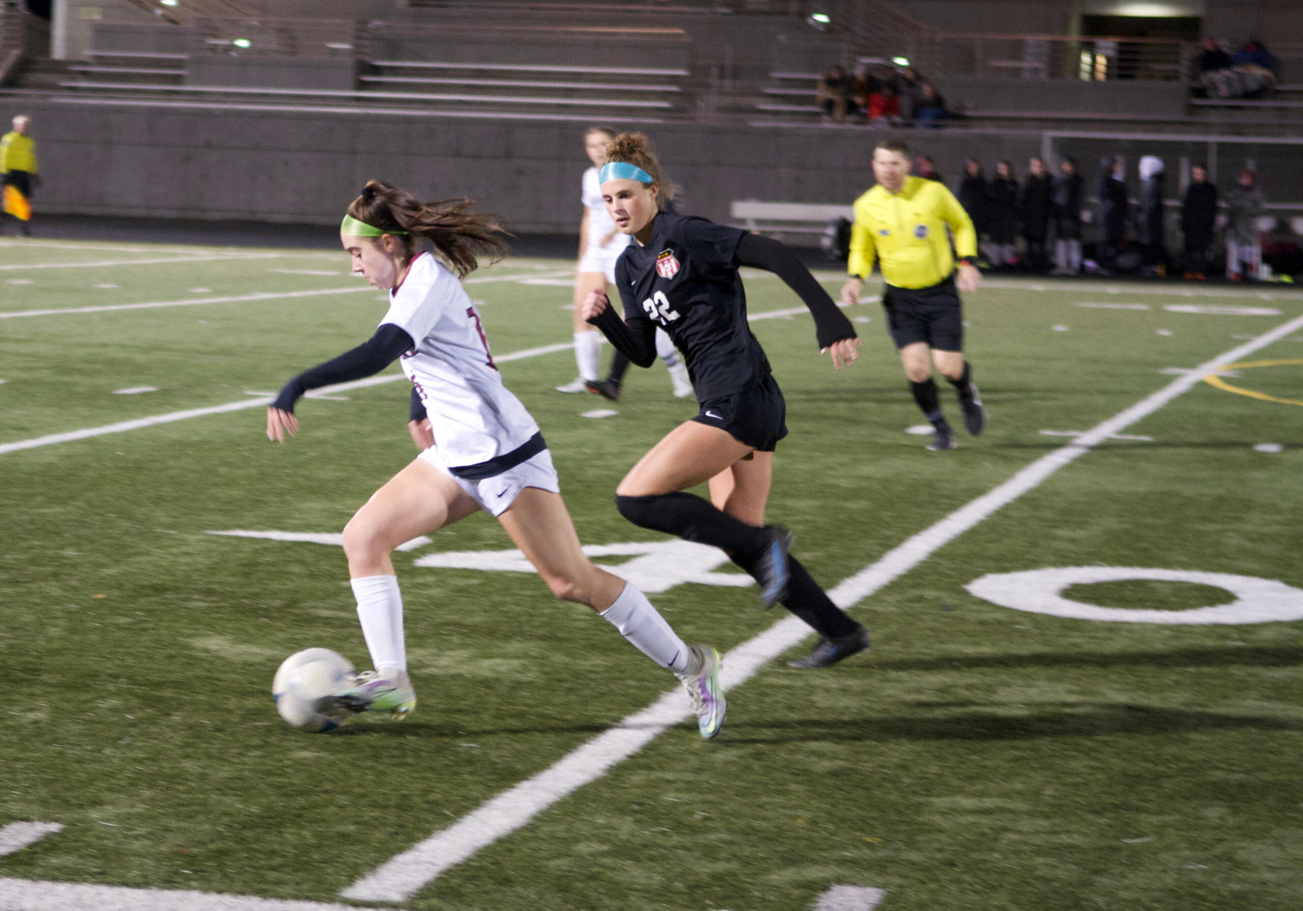 Camas forward Saige McCusker (22) chases Eastlake's Sophia Bonacci during a Class 4A first round state playoff soccer match on Tuesday, Nov. 8, 2022, at Doc Harris Stadium.