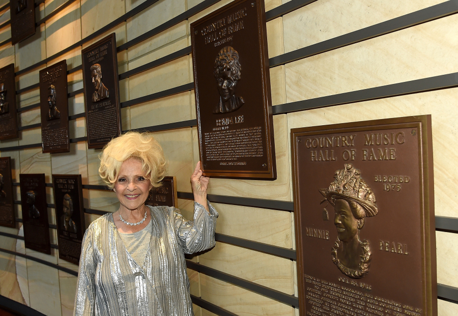 Vocalist Brenda Lee stands with her plaque at The Country Music Hall of Fame & Museum on June 11, 2016, in Nashville.