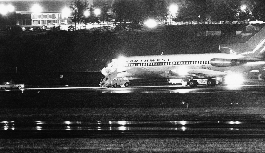 A hijacked Northwest Airlines jetliner sits on a runway for refueling at Seattle-Tacoma International Airport on  Nov. 25, 1971.