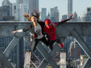 MJ (Zendaya) and Spider-Man (Tom Holland) jump off a bridge in "Spider-Man: No Way Home." (Matt Kennedy/Sony Pictures/TNS)