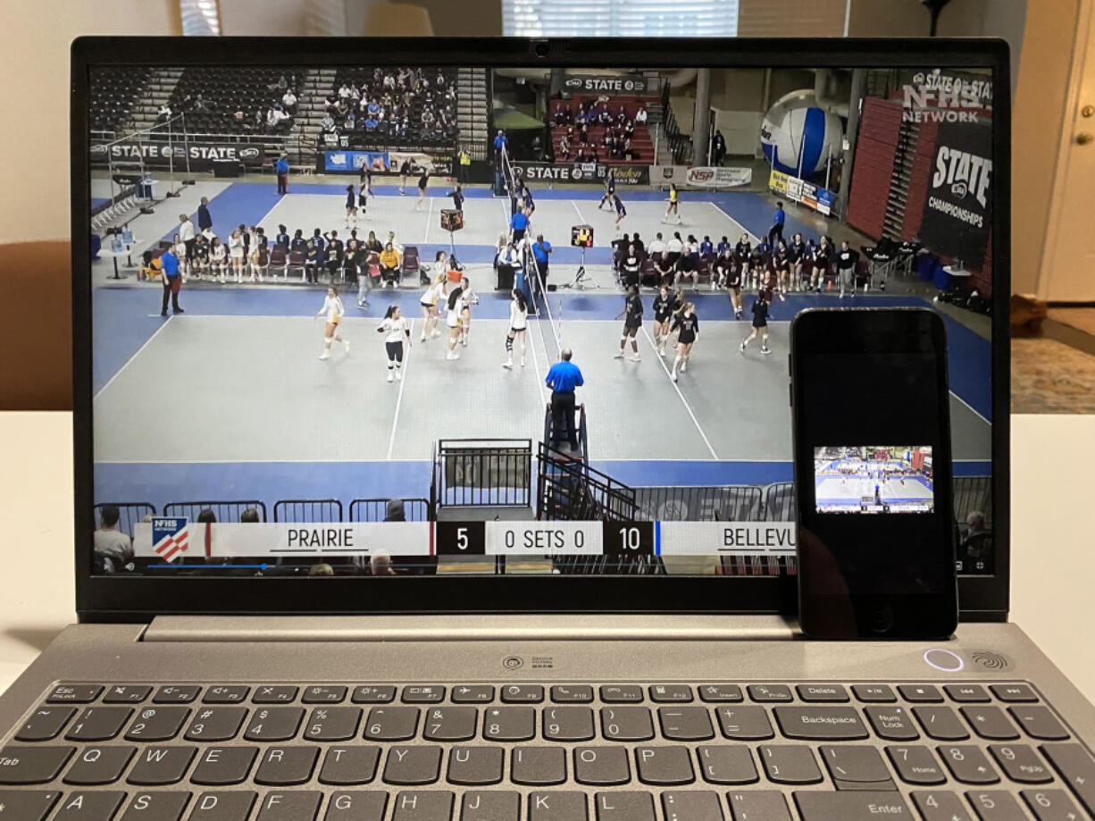 Prairie High School's first-round state volleyball match, which took place in Yakima last week, broadcast by the NHFS Network, shown on a laptop and iPhone.