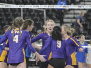 Sophie Worden, center, and her Columbia River teammates gather during the Class 2A volleyball state championship match against Ridgefield on Saturday, Nov. 19, 2022, in Yakima.