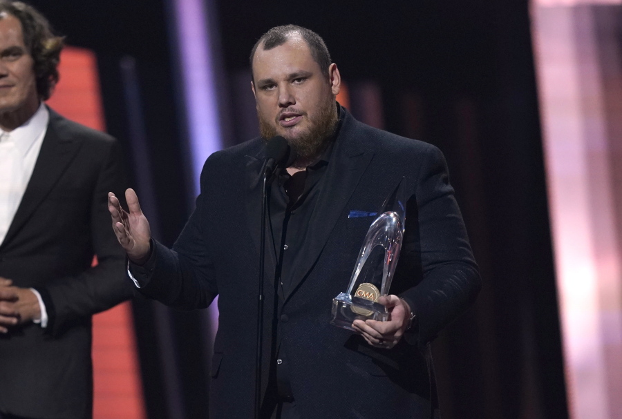 Luke Combs accepts the award for entertainer of the year during the 56th Annual CMA Awards on Wednesday, Nov. 9, 2022, at the Bridgestone Arena in Nashville, Tenn.