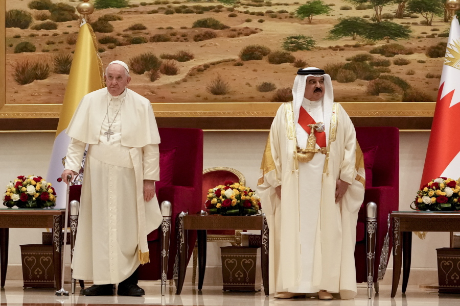 Pope Francis is greeted by Bahrain's King Hamad bin Isa Al Khalifa as he arrives at the Sakhir Royal Palace, Bahrain, Thursday, Nov. 3, 2022. Pope Francis is making the November 3-6 visit to participate in a government-sponsored conference on East-West dialogue and to minister to Bahrain's tiny Catholic community, part of his effort to pursue dialogue with the Muslim world.