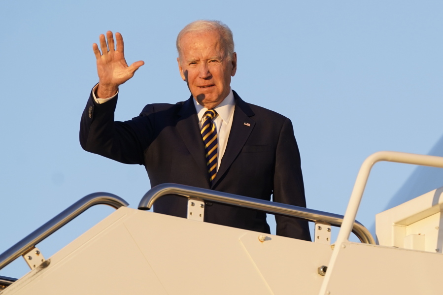 President Joe Biden waves as he boards Air Force One, Monday, Nov. 21, 2022, at Andrews Air Force Base, Md. Biden is traveling to Marine Corps Air Station Cherry Point in Havelock, N.C., to participate in Thanksgiving festivities with members of the military and their families.